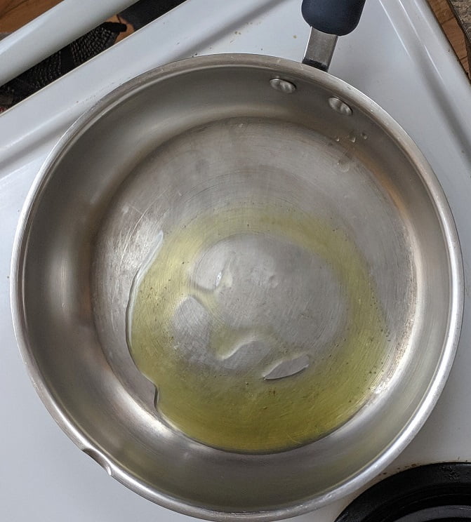 Olive oil heating in the frying pan