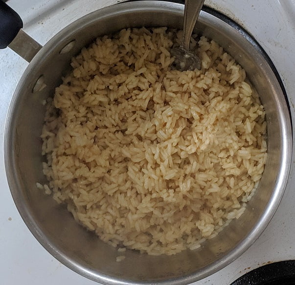 Spooning stroganoff over the rice