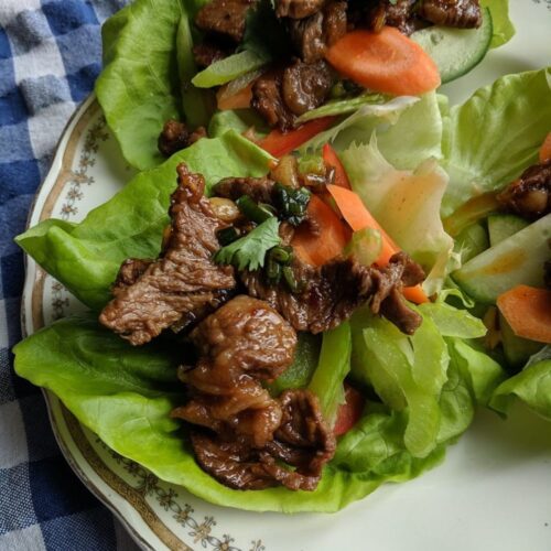 Ginger beef with vegetables on lettuce wraps