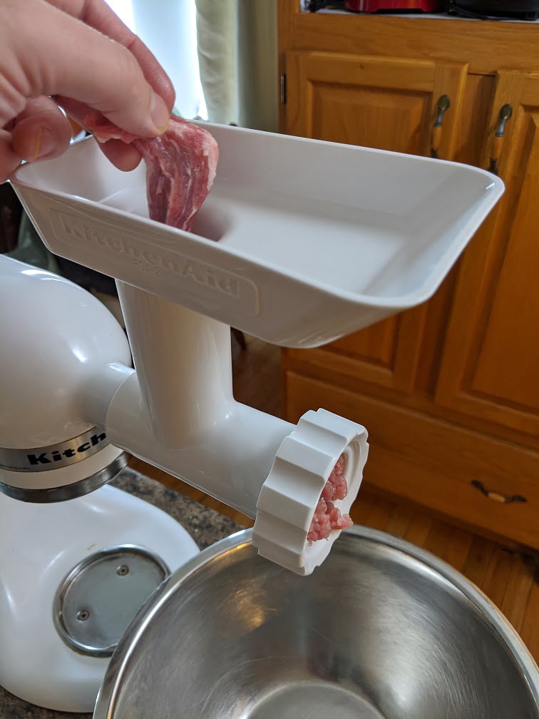 KitchenAid meat grinder attachment set up and ready to grind pork