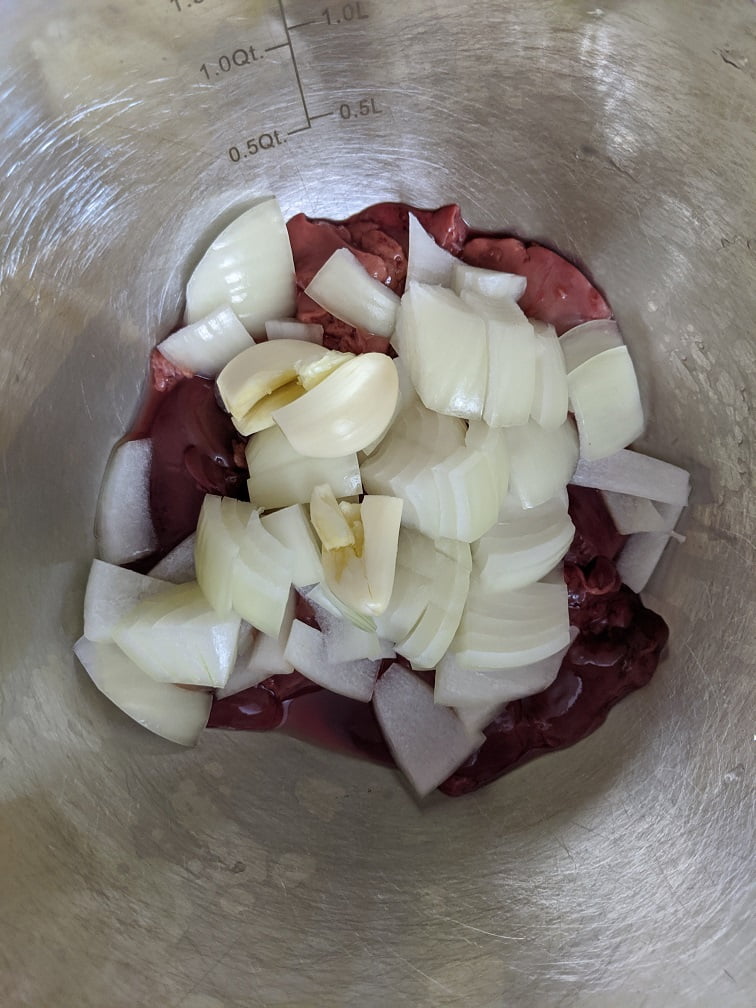 Ground pork and liver in a mixing bowl
