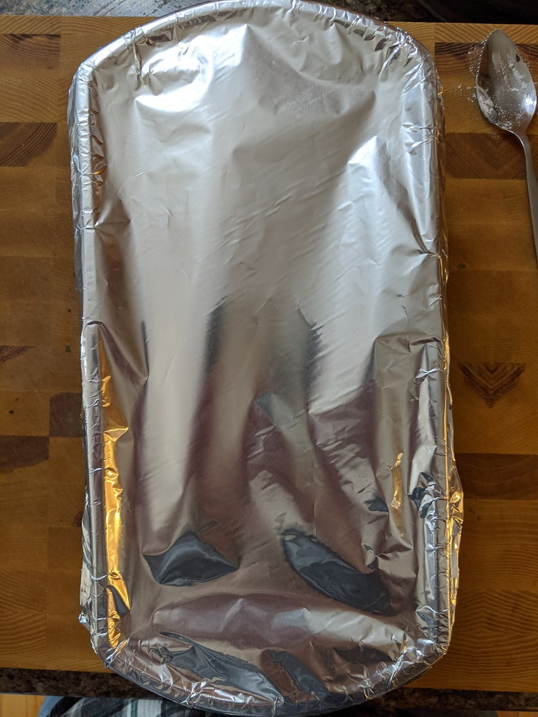 Loaf pan set in a roasting pan for the water bath