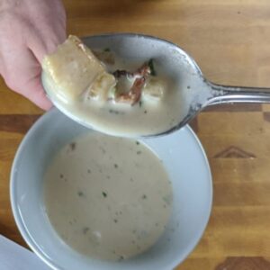 A spoonful of bacon and scallop chowder