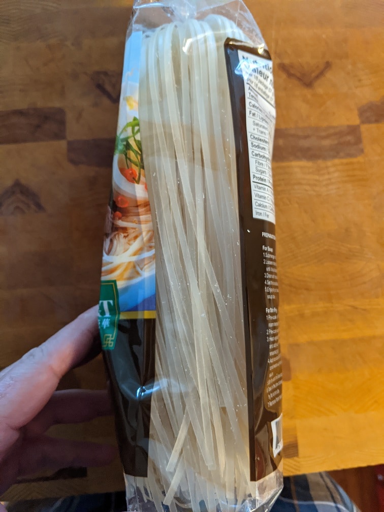 Rice noodles added to boiling water