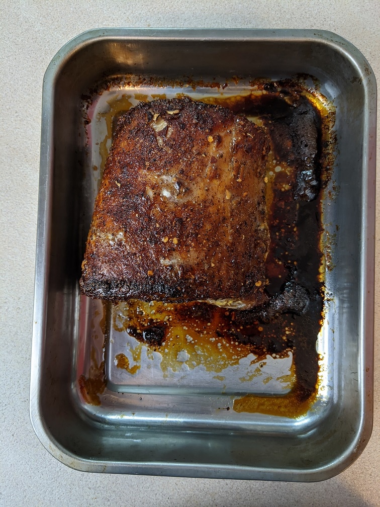 Roasted Chinese BBQ pork resting on a cutting board