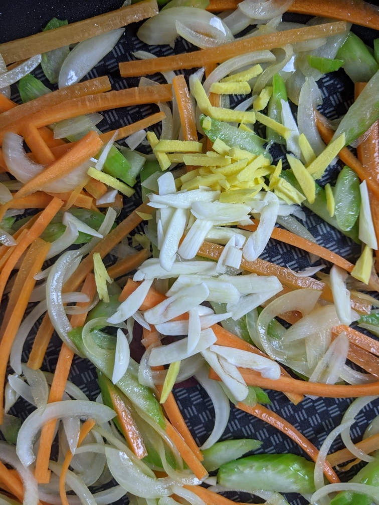 Garlic and ginger added to the stir-fry