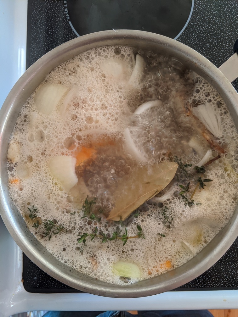 Chicken stock simmering on low heat