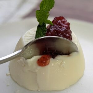 Vanilla Panna Cotta topped with blueberry compote and mint