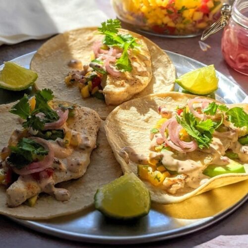 Fish Tacos with mango salsa, pickled red onions and cilantro