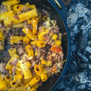 Pasta cooking over a campfire