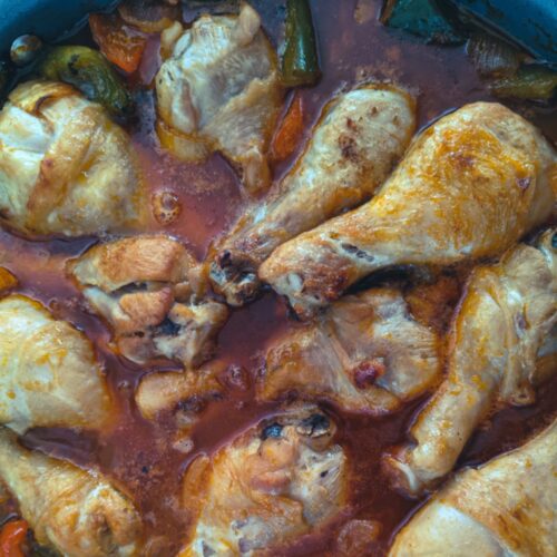 Chicken drumsticks braised in homemade sweet and sour sauce with bell peppers and onions