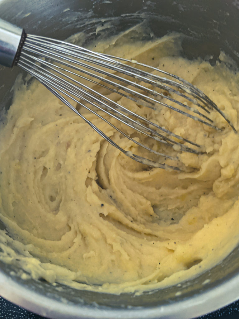 Potatoes becoming smooth and creamy as they are whisked