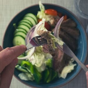 Steak Salad with Blue Cheese Dressing, cucumbers, tomatoes, and red onion